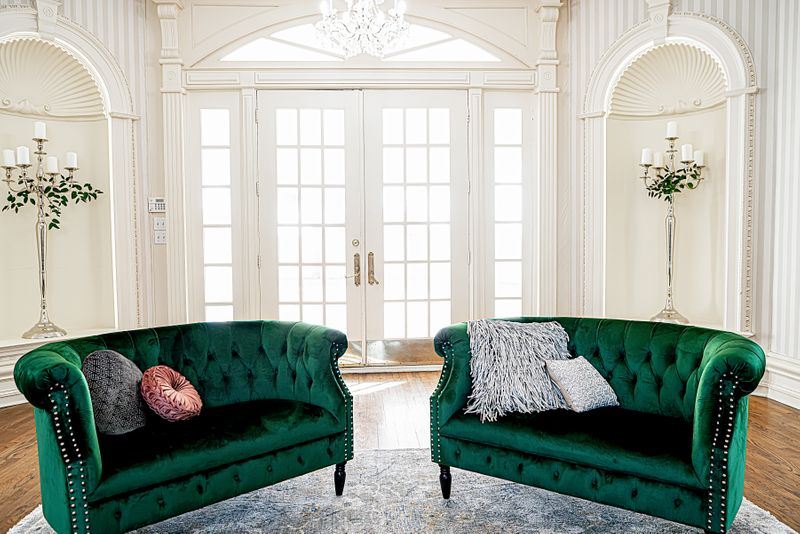 two green velvet couches