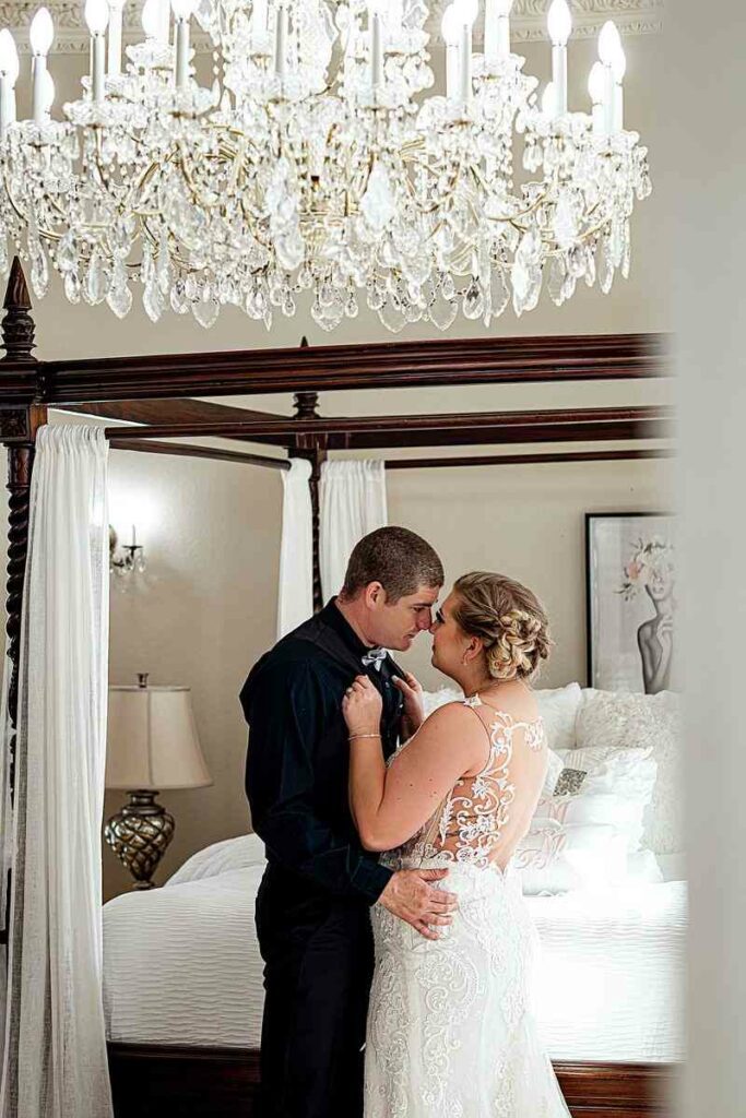bride and groom inside the bridal suite with beautiful chandelier