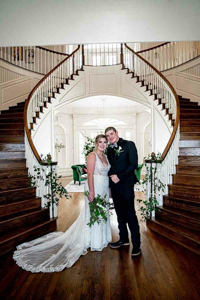 bride and groom inside the wedding venue mansion
