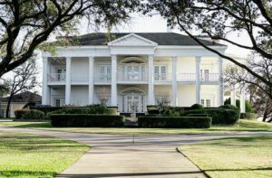 outside photo of a white mansion