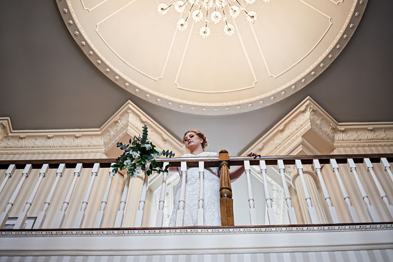 Bride overlooking the beautiful mansion