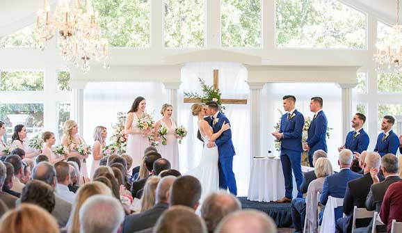 happy couple getting married in the ballroom