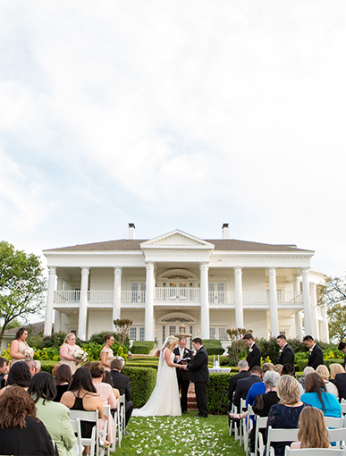 wedding ceremony outside mansion
