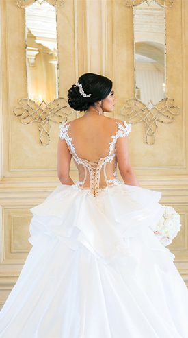 a bride faced away from camera showing back of dress